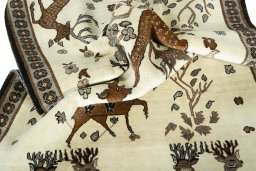 Corner detail of 2000s Persian Gabbeh rug showing border pattern and Wool pile