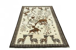 Surface texture of 2000s Persian Gabbeh rug with natural Wool and intricate pattern