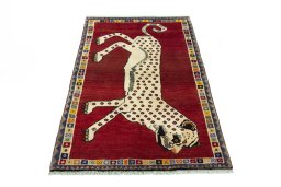 Surface texture of 2000s Persian Gabbeh rug with natural Wool and intricate pattern