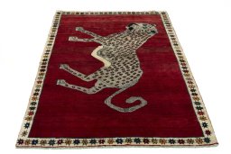 Surface texture of 2000s Persian Gabbeh rug with natural Wool and intricate pattern