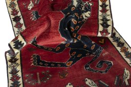 Corner detail of 2000s Persian Gabbeh rug showing border pattern and Wool pile