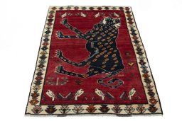 Surface texture of 2000s Persian Gabbeh rug with natural Wool and intricate pattern