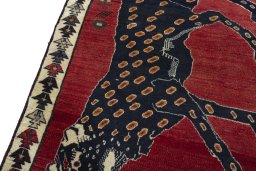 Backside of handmade 2000s Persian Gabbeh rug showing knot structure and weave density