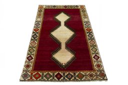 Surface texture of 2000s Persian Gabbeh rug with natural Wool and intricate pattern