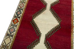 Backside of handmade 2000s Persian Gabbeh rug showing knot structure and weave density