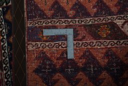 Corner detail of 2000s Persian Gabbeh rug showing border pattern and Wool pile