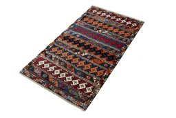 Corner detail of 2000s Persian Gabbeh rug showing border pattern and Wool pile