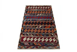 Surface texture of 2000s Persian Gabbeh rug with natural Wool and intricate pattern