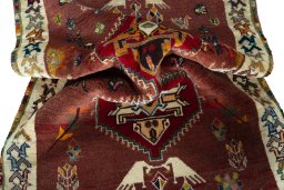 Corner detail of 2000s Persian Gabbeh rug showing border pattern and Wool pile