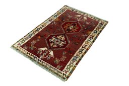 Corner detail of 2000s Persian Gabbeh rug showing border pattern and Wool pile