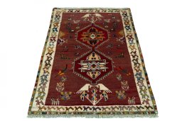 Surface texture of 2000s Persian Gabbeh rug with natural Wool and intricate pattern