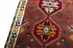 Backside of handmade 2000s Persian Gabbeh rug showing knot structure and weave density