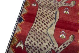 Backside of handmade 2000s Persian Gabbeh rug showing knot structure and weave density