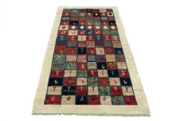 Surface texture of 2000s Persian Gabbeh rug with natural Wool and intricate pattern