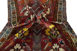 Corner detail of 1970s Persian Gabbeh rug showing border pattern and Wool pile