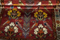 Full view of 1970s Persian Gabbeh rug from Iran / Persia, 225 × 132 cm in Red tones
