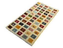 Corner detail of 2000s Persian Gabbeh rug showing border pattern and Wool pile