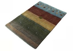 Corner detail of 2000s Persian Gabbeh rug showing border pattern and Wool pile