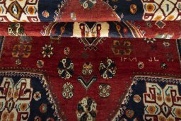 Corner detail of 2000s Persian Gabbeh rug showing border pattern and Wool pile