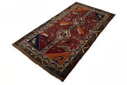Corner detail of 2000s Persian Gabbeh rug showing border pattern and Wool pile