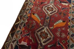 Backside of handmade 2000s Persian Gabbeh rug showing knot structure and weave density