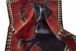 Corner detail of 2000s Persian Gabbeh rug showing border pattern and Wool pile