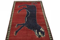 Surface texture of 2000s Persian Gabbeh rug with natural Wool and intricate pattern