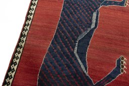 Backside of handmade 2000s Persian Gabbeh rug showing knot structure and weave density