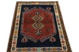 Surface texture of 2000s Persian Gabbeh rug with natural Wool and intricate pattern