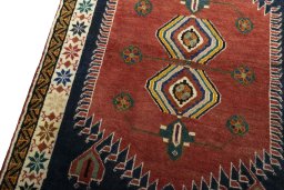 Backside of handmade 2000s Persian Gabbeh rug showing knot structure and weave density