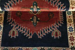 Full view of 2000s Persian Gabbeh rug from Iran / Persia, 142 × 102 cm in Red tones