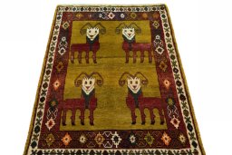 Surface texture of 2000s Persian Gabbeh rug with natural Wool and intricate pattern
