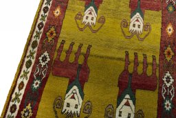Backside of handmade 2000s Persian Gabbeh rug showing knot structure and weave density