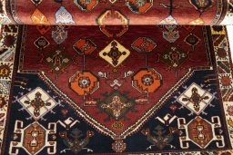 Corner detail of 2000s Persian Gabbeh rug showing border pattern and Wool pile