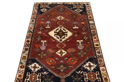 Surface texture of 2000s Persian Gabbeh rug with natural Wool and intricate pattern