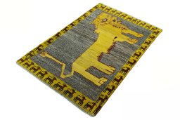 Corner detail of 2000s Persian Gabbeh rug showing border pattern and Wool pile