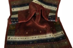 Corner detail of 2000s Persian Gabbeh rug showing border pattern and Wool pile