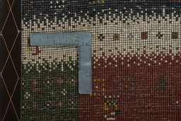 Close-up detail of 2000s Persian Gabbeh rug from Iran / Persia showing Wool weave