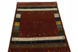 Surface texture of 2000s Persian Gabbeh rug with natural Wool and intricate pattern