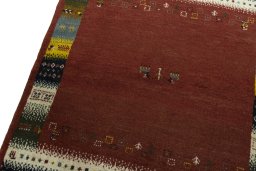 Backside of handmade 2000s Persian Gabbeh rug showing knot structure and weave density
