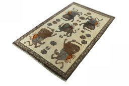 Corner detail of 2000s Persian Gabbeh rug showing border pattern and Wool pile