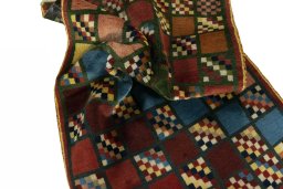 Corner detail of 2000s Persian Gabbeh rug showing border pattern and Wool pile