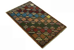 Close-up detail of 2000s Persian Gabbeh rug from Iran / Persia showing Wool weave
