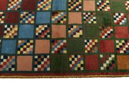 Close-up detail of 2000s Persian Gabbeh rug from Iran / Persia showing Wool weave