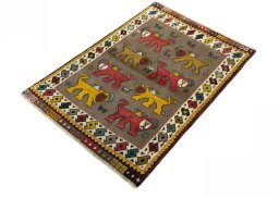 Corner detail of 2000s Persian Gabbeh rug showing border pattern and Wool pile