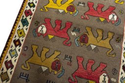 Backside of handmade 2000s Persian Gabbeh rug showing knot structure and weave density