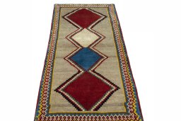 Surface texture of 2000s Persian Gabbeh rug with natural Wool and intricate pattern