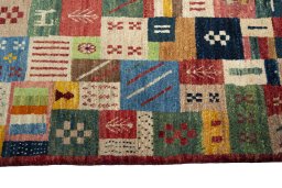 Close-up detail of 2000s Persian Gabbeh rug from Iran / Persia showing Wool weave