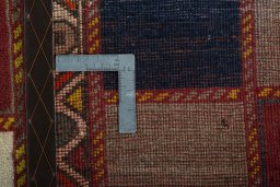 Corner detail of 2000s Persian Gabbeh rug showing border pattern and Wool pile