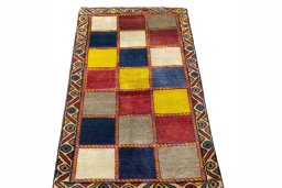 Surface texture of 2000s Persian Gabbeh rug with natural Wool and intricate pattern